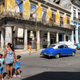 In this photo taken May 13, 2015 people walk past a shell of a building with the sky visible in Havana, Cuba. House Republicans have voted to keep restrictions on Americans seeking to travel to Cuba. That's a setback to Obama administration efforts to ease the five-decade Cold War standoff. The GOP-controlled chamber voted 247-176 to keep a Cuba-related provision in a transportation funding bill. The provision would block new rules issued in January that would significantly ease travel restrictions to Cuba and allow regularly scheduled flights for the first time.